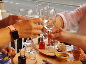 Group toasting glasses on patio